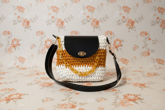 gold black and white crochet handbag