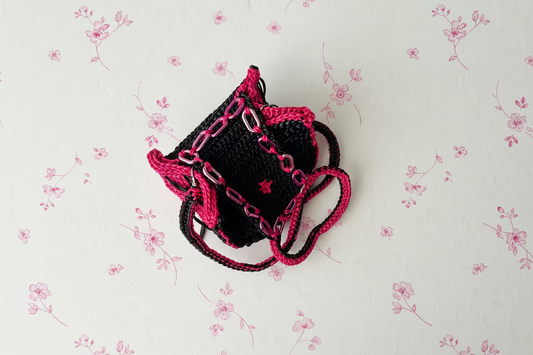 black and pink fuschia crochet handbag