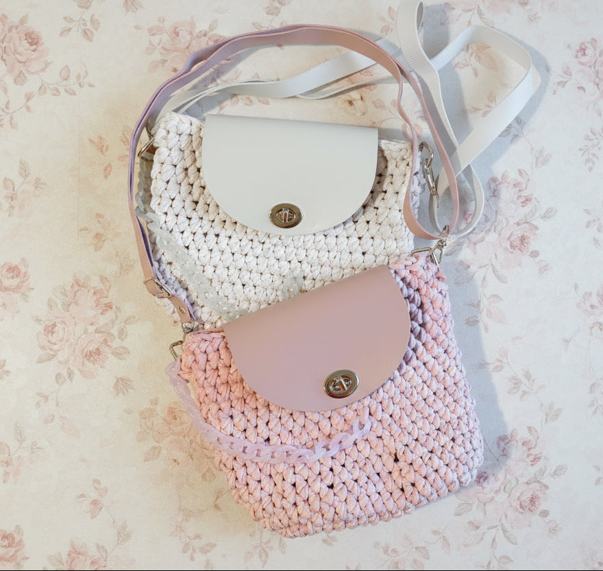pink and white crochet handbag